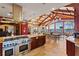 Spacious kitchen with granite countertops, stainless steel appliances, and lake views at 2844 Marquesas Ct, Windermere, FL 34786