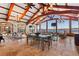 Open living space with beamed ceilings, tile floors, and panoramic lake views at 2844 Marquesas Ct, Windermere, FL 34786