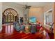 Living area boasting hardwood floors, lake views, and high-end entertainment setup at 2844 Marquesas Ct, Windermere, FL 34786
