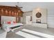 Stunning main bedroom showcases a stone fireplace, custom wood accent wall, and ample space for a luxurious feel at 2844 Marquesas Ct, Windermere, FL 34786