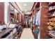 Well-organized walk-in closet with custom shelving, rods, and ample storage space for all your wardrobe needs at 2844 Marquesas Ct, Windermere, FL 34786