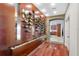 Custom wine display with stone archway and hardwood floors at 2844 Marquesas Ct, Windermere, FL 34786