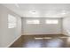 Comfortable bedroom featuring hardwood floors, neutral paint, and lots of natural light at 3434 Se 12Th St, Ocala, FL 34471
