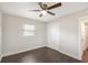 Bedroom featuring hardwood floors, a ceiling fan, closet and natural light at 3434 Se 12Th St, Ocala, FL 34471