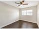 Bedroom featuring hardwood floors, a ceiling fan and a window for natural light at 3434 Se 12Th St, Ocala, FL 34471