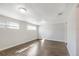 Cozy bedroom featuring hardwood floors, neutral paint, and lots of natural light at 3434 Se 12Th St, Ocala, FL 34471