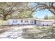 Charming single-story home showcasing a well-maintained front lawn and a curved driveway leading to the entrance at 3434 Se 12Th St, Ocala, FL 34471