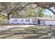 Charming single-story home with freshly painted white exterior and well-maintained front yard at 3434 Se 12Th St, Ocala, FL 34471
