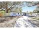 Charming single-story home with freshly painted white exterior, and long driveway at 3434 Se 12Th St, Ocala, FL 34471