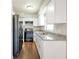 Well-appointed kitchen with granite countertops, black appliances, and white cabinets for a clean, modern look at 3434 Se 12Th St, Ocala, FL 34471
