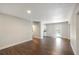 Bright and spacious living area with beautiful hardwood floors, neutral paint, and kitchen views at 3434 Se 12Th St, Ocala, FL 34471