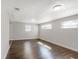 Bright living room featuring hardwood floors, natural light, and neutral paint, creating a welcoming atmosphere at 3434 Se 12Th St, Ocala, FL 34471