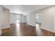 Spacious living area with beautiful hardwood floors, neutral paint, and multiple entrances at 3434 Se 12Th St, Ocala, FL 34471