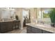 Bright bathroom features granite countertops and dual sink vanity at 355 S Sunset Ave, Mascotte, FL 34753