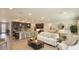 Open-concept living area with a view of the modern kitchen and dining area at 355 S Sunset Ave, Mascotte, FL 34753