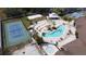 Overhead view featuring a kidney bean pool, tennis court, and beach volleyball in a resort community at 373 Caribbean Dr, Davenport, FL 33897