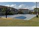 Community basketball court set against buildings, with well-maintained play surface at 373 Caribbean Dr, Davenport, FL 33897