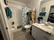 Efficient bathroom with shower and tub, neutral vanity, and functional layout at 373 Caribbean Dr, Davenport, FL 33897