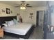 Cozy bedroom featuring light grey floors, natural lighting, and ample closet space at 373 Caribbean Dr, Davenport, FL 33897