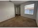 Bedroom featuring carpet, window with blinds, and closet at 373 Caribbean Dr, Davenport, FL 33897