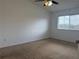 Bedroom featuring neutral walls, carpet, and a window with blinds at 373 Caribbean Dr, Davenport, FL 33897