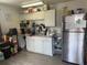 Functional kitchen with white cabinetry, stainless steel appliances, and a pantry space at 373 Caribbean Dr, Davenport, FL 33897