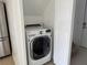 Laundry area with large capacity washer and dryer in the utility space at 373 Caribbean Dr, Davenport, FL 33897