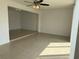 Open-concept living room boasts tile flooring and ample natural light at 373 Caribbean Dr, Davenport, FL 33897