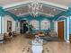 Bright and inviting lobby with high ceilings, elegant chandelier, and comfortable seating at 373 Caribbean Dr, Davenport, FL 33897