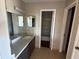 Bathroom featuring a double sink vanity and a shower at 4358 Aqua Vista Dr # G, Orlando, FL 32839
