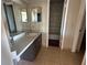 Standard bathroom with a single sink, dark cabinets, and a shower-tub combo at 4358 Aqua Vista Dr # G, Orlando, FL 32839