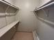 Empty walk-in closet with built in shelves at 4358 Aqua Vista Dr # G, Orlando, FL 32839