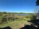 Back yard featuring lush green grass and a view of the lake at 4358 Aqua Vista Dr # G, Orlando, FL 32839