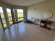 Living room with tile floors, a lake view, and furniture at 4358 Aqua Vista Dr # G, Orlando, FL 32839
