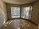 Living room filled with sunlight from large windows at 4358 Aqua Vista Dr # G, Orlando, FL 32839