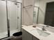 Modern bathroom featuring a glass-enclosed shower and updated vanity at 439 Mulberry Ct, Kissimmee, FL 34759