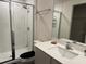 Modern bathroom featuring a glass-enclosed shower and updated vanity at 439 Mulberry Ct, Kissimmee, FL 34759