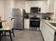 Well-equipped kitchen with granite counters, stainless steel appliances, and ample cabinet space at 439 Mulberry Ct, Kissimmee, FL 34759