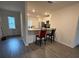 Open concept kitchen featuring granite countertops, stainless steel appliances, and eat-in breakfast bar at 439 Mulberry Ct, Kissimmee, FL 34759