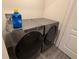 This laundry room includes modern Whirlpool washer and dryer units at 439 Mulberry Ct, Kissimmee, FL 34759