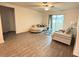 Bright living room with hardwood floors, modern furnishings, and a sliding glass door at 439 Mulberry Ct, Kissimmee, FL 34759