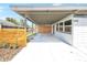 Spacious carport offering ample covered parking with a modern fence and neutral color palette, enhancing the home's exterior at 4429 Rossmore Dr, Orlando, FL 32810