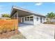 Charming single-story home featuring a carport, modern fence, and well-maintained landscaping, offering curb appeal at 4429 Rossmore Dr, Orlando, FL 32810