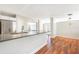 Bright kitchen with a large island, stainless steel appliances, and modern lighting at 4429 Rossmore Dr, Orlando, FL 32810