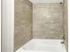 A close up of the shower featuring modern tile work and updated hardware at 4429 Rossmore Dr, Orlando, FL 32810