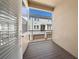 Inviting balcony featuring durable wood-look flooring and a view of neighboring homes in the community at 450 Windmill Palm Cir, Altamonte Springs, FL 32701