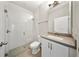 Modern bathroom featuring a glass shower, gray countertops, and a white vanity cabinet at 450 Windmill Palm Cir, Altamonte Springs, FL 32701