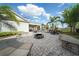 Inviting community space with a fire pit, ample seating, and lush landscaping for outdoor enjoyment at 450 Windmill Palm Cir, Altamonte Springs, FL 32701