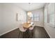 Elegant dining room with a pendant light fixture and natural light at 450 Windmill Palm Cir, Altamonte Springs, FL 32701