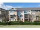 Charming multi-story townhome with manicured landscaping and classic architectural details at 450 Windmill Palm Cir, Altamonte Springs, FL 32701